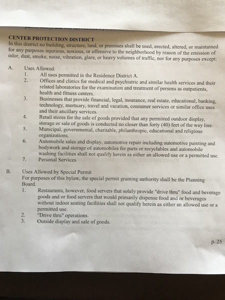 A document detailing land use rules for a center protection district, listing permitted uses.