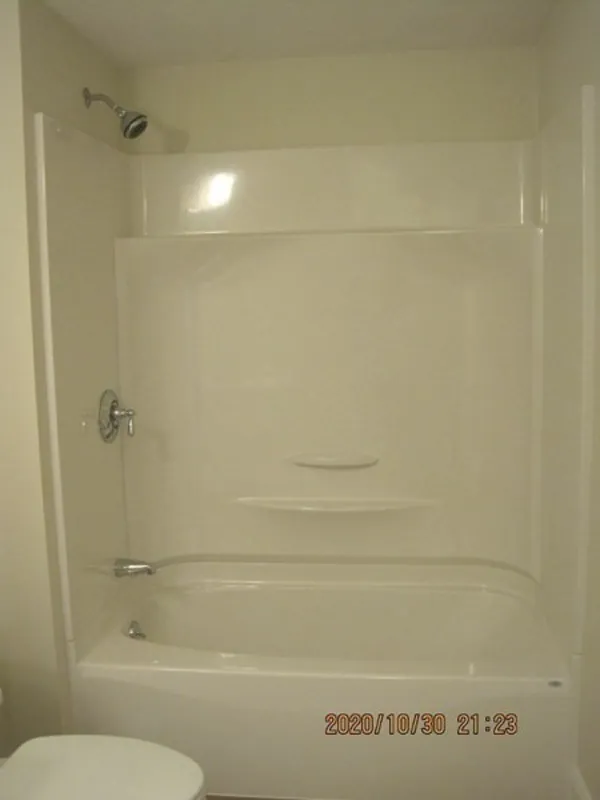 White bathtub and shower combo with a wall shelf, dated 2020/10/30 at the bottom.