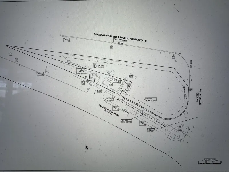 Site plan drawing showing building layout and labeled features near a curved highway (RT.6).