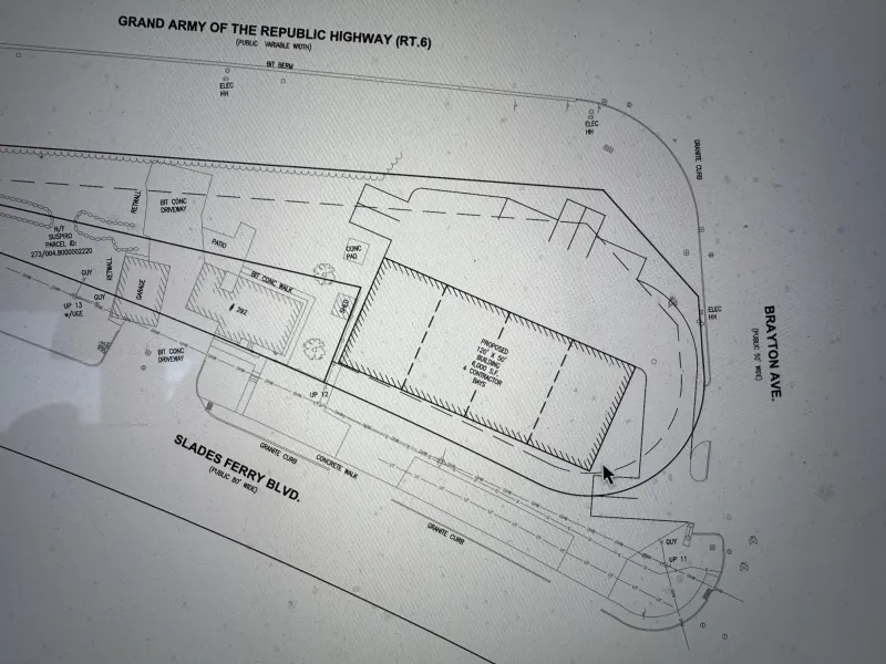 Engineering site plan showing roadways and building outlines at an intersection.