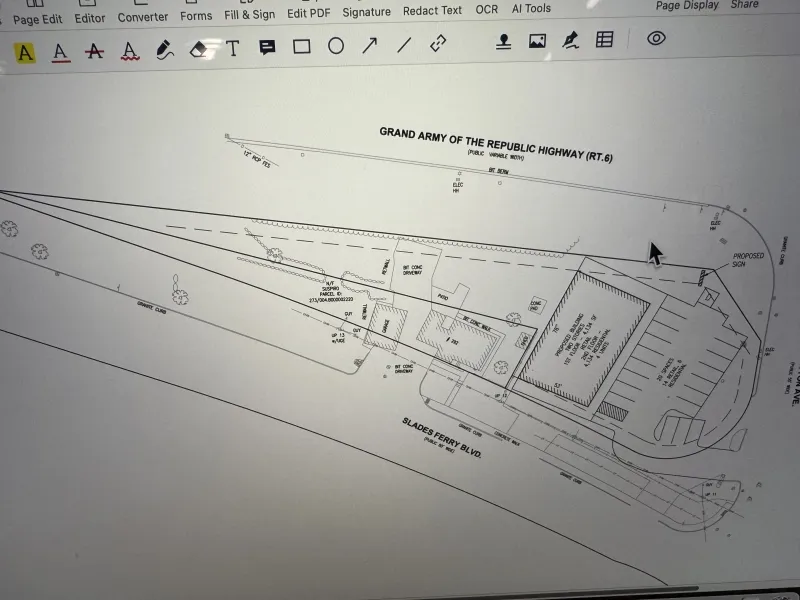 Architectural site plan displayed on a computer screen, showing building and parking layout.